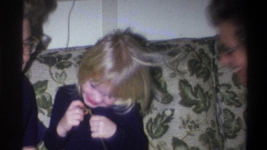 1973: grandma snuggling her grandchild. NEW YORK