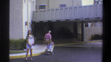 1973: a clip of presumably husband and wife who have returned home from grocery
