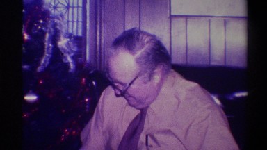 1973: man getting present on christmas NEW YORK