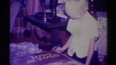 1973: a boy seems to be enjoying playing himself in a room NEW YORK