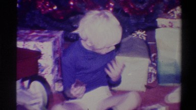 1973: Toehead Boy Sitting on Floor with Christmas Presents New York