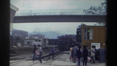 1982: train with pas anger,man ,house , travel with train , railway aerie , many