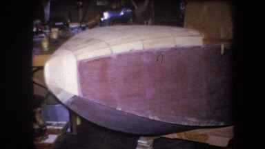 1964: solid and rounded wooden structure resembling airplane nose has black pipe