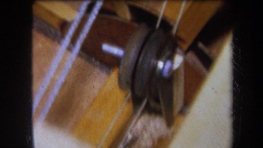 1964: a wooden device with a pulley connected to two wires VOLMER YUCAIPA