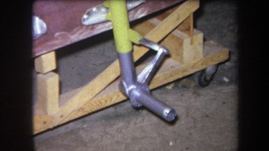 1964: full panning view of metal object or part from warehouse or storage