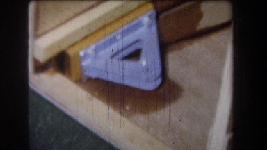 1965: metal pipe and key structure is between triangular metal plates attached