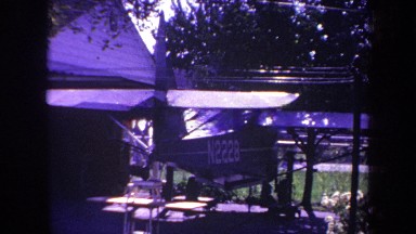 1969: plane in garage next to house in yard VOLMER YUCAIPA CALIFORNIA