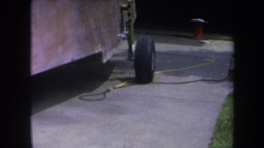 1969: changing the tire of a red car VOLMER YUCAIPA CALIFORNIA