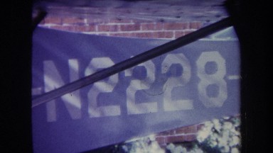 1969: id number n2228 is printed on narrowing panel placed between brick wall