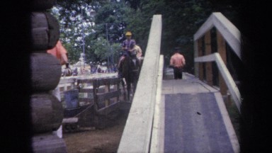1968: a kid dismounts from a horse onto a platform MICHIGAN