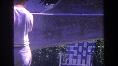 1969: a man is spray painting something on a sunny day VOLMER YUCAIPA CALIFORNIA