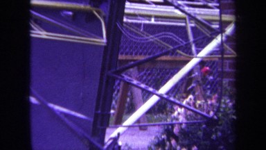 1969: construction and wiring outside of large building. VOLMER YUCAIPA