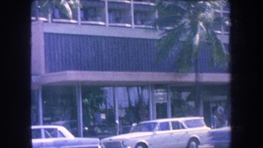 1969: cars moving down a sunny southern california street HAWAII