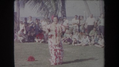1969: woman dances in hawaii like there is no one else around in front of crowd
