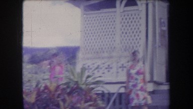 1969: women walk out of small building in a rural area, man nods as they've pass