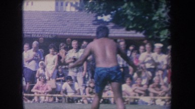 1969: tan gentleman putting on a show in blue shorts HAWAII
