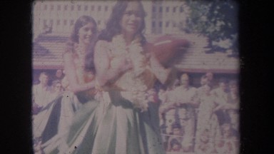 1969: people hula dancing and playing a drum HAWAII