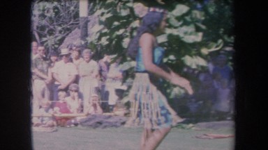 1969: hula dancers performing in front of a crowd. HAWAII