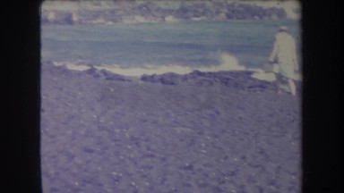 1969: A Day at the Beach in Hawaii with Woman in Head Scarf and Friends