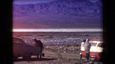 1958: a gathering of cars and people near a mountain ARIZONA