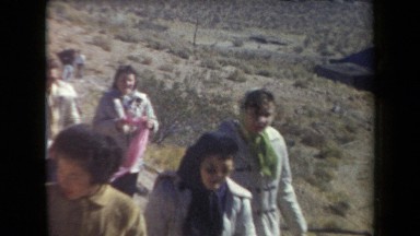 1958: crowd of people walking up a hill in the mountains ARIZONA