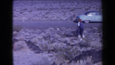 1958: people walking in outer city, and the climate is so heat on the area