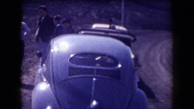 1958: people standing near to parked cars near to a mountain ARIZONA