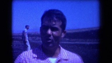 1958: oil workers standing and talking in open space Arizona