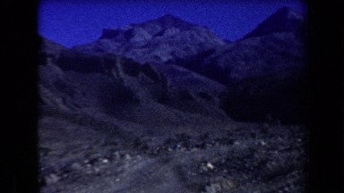 1958: dozens of people in an arid, desert-like area exploring and searching
