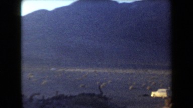 1958: Group of Friends Gathered in the Arizona Desert with Tents and Campfire