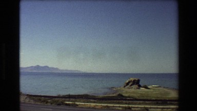 1980: Lake and Mountain Landscape Near Highway Western USA