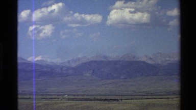 1980: panorama of a countryside with a few homes, barns and plowed fields