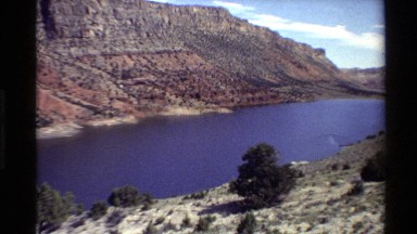 1980: a wide river flowing slowly surrounded by arid plateaus WESTERN USA