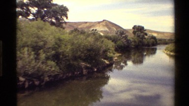 1980: beautiful river to see, in the middle of mountain and tree WESTERN USA