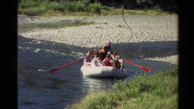 1980: raft on moderate sized river with about 8 people in it WESTERN USA