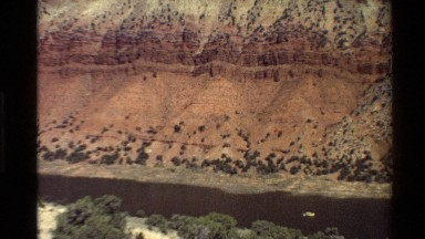 1980: boat sails in riverbank of a beautiful canyon. WESTERN USA