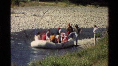 1980: a group of people getting in a raft WESTERN USA