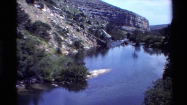 1980: a river or valley that seems to be cut through a mountain area without any