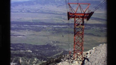 1980: tourist people going down in a ropeway tower. WESTERN USA