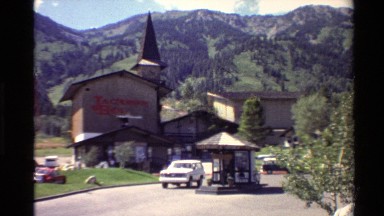 1980: a car driving past a building called jackson hole, followed by a close up