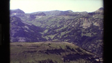 1980: nature scene at hills, coverage of roads. WESTERN USA
