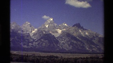 1980: hills in front of peaks that have snow in their valleys WESTERN USA