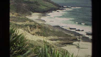 1981: Camera Panning Over Rocky New Zealand Coastline With Waves