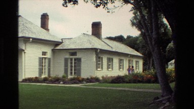 1981: Two Women Walking from Back to Front of a New Zealand Home