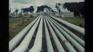 1981: industrial pipes leading to buildings emitting columns of white smoke