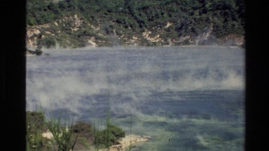 1981: columns of steam rising from a pool of water NEW ZEALAND