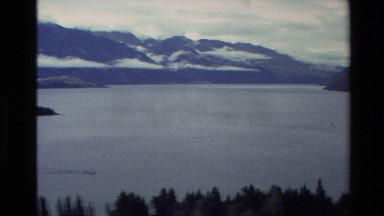 1982: panoramic view of trees, lake and mountain NEW ZEALAND