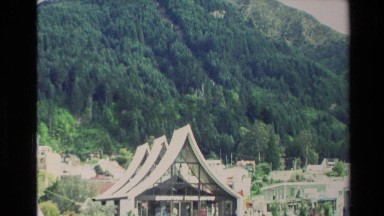 1982: a large area with lots of grass and a mountain around NEW ZEALAND