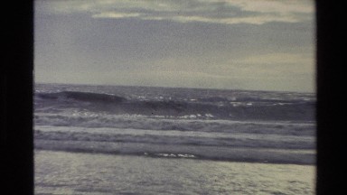 1982: waves rolling in to beach NEW ZEALAND