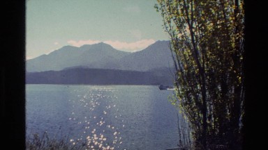 1982: a beautiful lake surrounded by mountain ranges and greenery NEW ZEALAND
